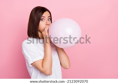 Photo of pretty childish girl pumping white balloon prepare for weekend celebration isolated on pink color background Royalty-Free Stock Photo #2123092070