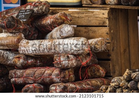 heap of cured sausages in the market