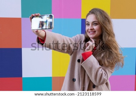 beautiful young caucasian woman doing a selfie 
