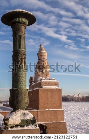 inscription on pedestal translates as Sphinx from ancient Egypt was transported to St. Petersburg in 1893. Ancient Egyptian Sphinx on University Embankment of the Neva River in St. Petersburg. Russia