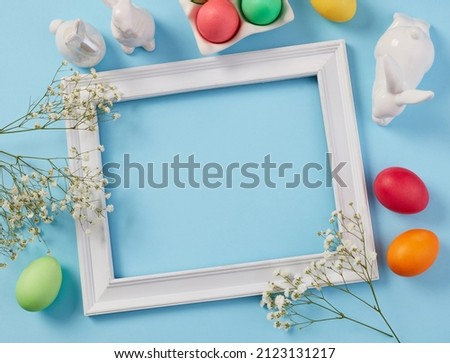 Photo Frame, Colorful Easter Eggs and Spring Flowers
