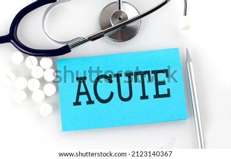 Text ACUTE on a table with stethoscope,pills and pen, medical concept. Royalty-Free Stock Photo #2123140367