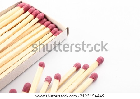 Matches and matchbox on white background, closeup