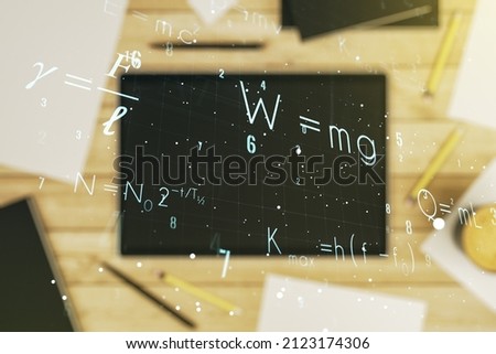 Double exposure of creative scientific formula concept and digital tablet on background, top view, research and development concept