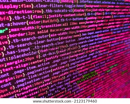 Programmer working on computer screen. Lines of code of a software with several colors. Creative Js HTML5 closeup set on background. SEO concepts for better SERP. Javascript code in bracket software