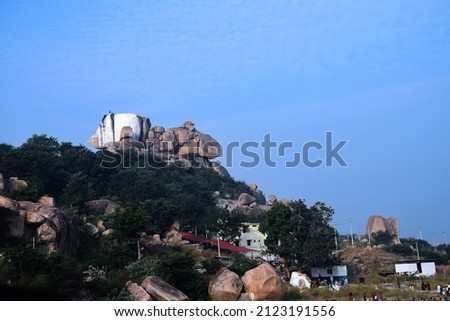 Stock photo of big rocks standing without any support on the ancient hindu temple hills, lord mallayya temple situated in the top of the hill. Picture captured at yadgir , mailapur, Karnataka, India.