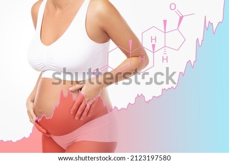 Young pregnant woman and rising chart of progesterone hormone level during pregnancy Royalty-Free Stock Photo #2123197580