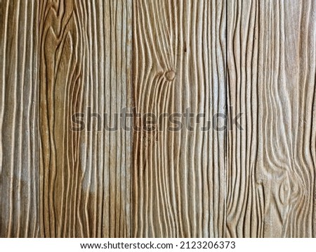 Old brown shera wood panels are patterned like real wood used in the construction of houses. Brown shera wood wall texture use for background.  Fake woods plank texture background with copy space.