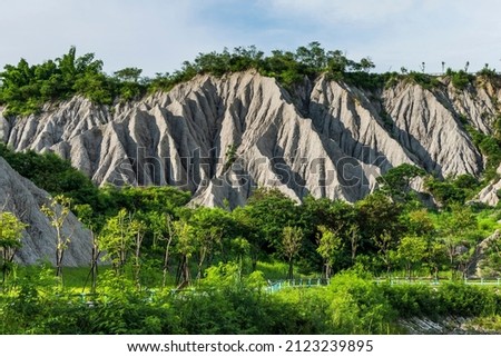 Badlands Geological landscape of Tianliao Moon World in Kaohsiung, Taiwan. it's famous for its similarity to the landscape of the Moon's surface. Royalty-Free Stock Photo #2123239895