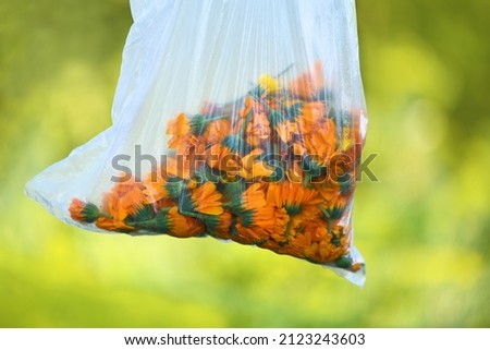 Bag with flowers of calendula, velvet close-up