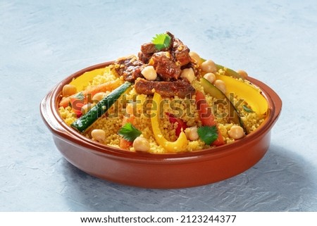 Meat and vegetable couscous in a bowl, typical food from Morocco, a traditional festive Arabic dish with herbs and spices Royalty-Free Stock Photo #2123244377