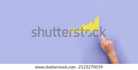 Male hand holding graph icon.checking analyzing sales data growth graph chart and stock market on global networking. Business strategy, planning and digital marketing. Royalty-Free Stock Photo #2123270039