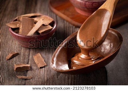 Chocolate Easter egg filled with chocolate ganache. Royalty-Free Stock Photo #2123278103