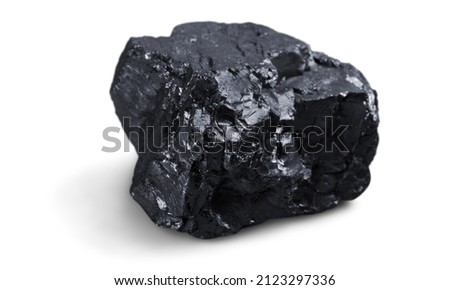 Meteorite black stone rock on background.