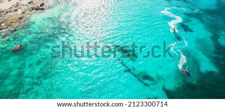 Amazing top view of water bikes. Aerial view of blue Caribbean sea in Cancun in Mexico