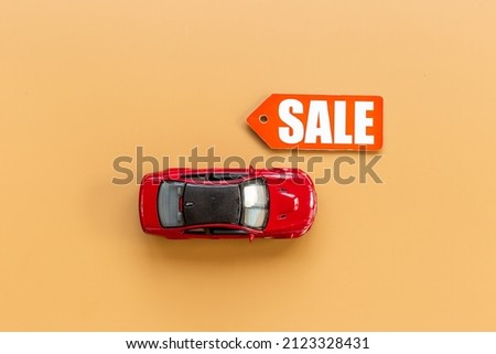 Sale label with small car model - sale of cars concept