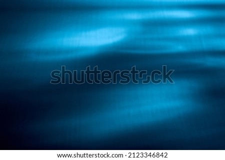 Blue color background. Awesome abstract blur texture for website mockup. Blurred beams, light rays. Water wallpaper. Art decor. Waves pattern. Swimming or spa design concept. Business card template.