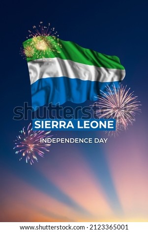 Majestic sky with holiday fireworks and flag of Sierra Leone on National day
