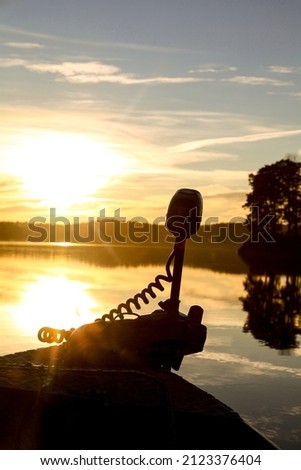 Electric trolling motor, perfect for fishing, picture taken at dawn. Silent and zero emission.