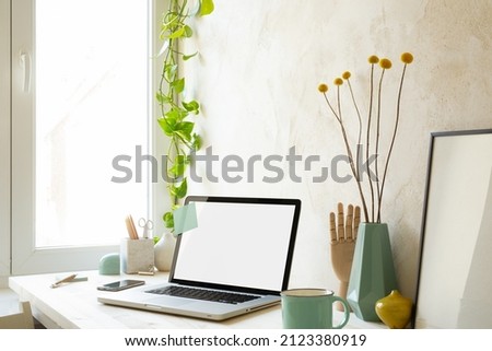 Workspace at home with laptop.  Stylish home office workplace.	Mockup.