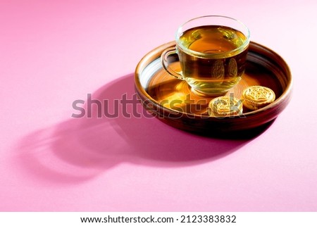 Tea with dessert on a bright colored background