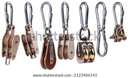 Pulleys and shackles for ropes on a ship and sailing ship.  Royalty-Free Stock Photo #2123406143