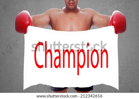 fight and competition sign with an red boxing glove holding a white banner and word champion as a business symbol of competitive sale or boxing specials day 