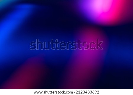 Blur color flare. Neon glow background. Bokeh radiance reflection. Defocused fluorescent blue pink light gleam on dark abstract overlay. Royalty-Free Stock Photo #2123433692