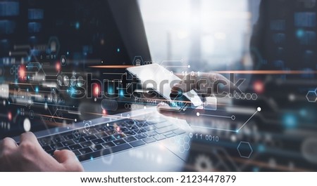 Digital technology, software development, Data exchange, Internet of Things concept. Man using mobile phone and laptop with circuit board on virtual screen, high speed internet technology