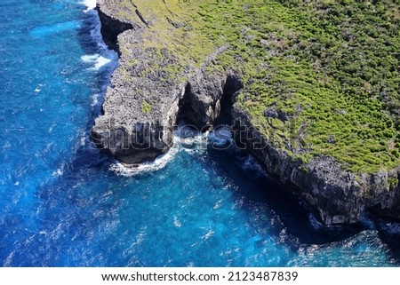 An ariel shot of coast of Northern Mariana Islands in shiny day Royalty-Free Stock Photo #2123487839