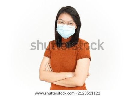 Wearing Mask And Folding Arms Of Beautiful Asian Woman Isolated On White Background