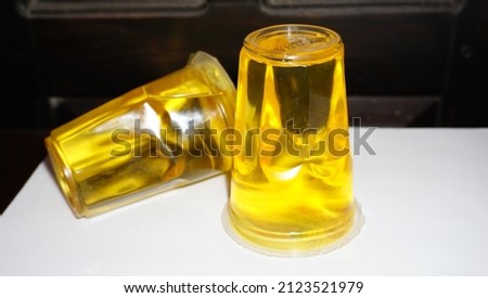 Packaged cooking oil in a couple of glasses