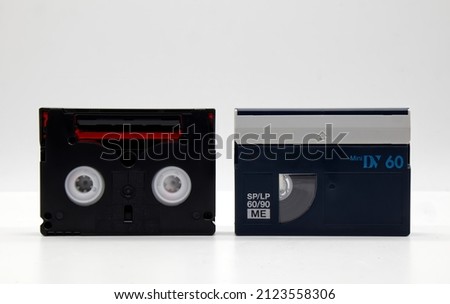 Vintage Mini DV video tape cassette isolated on white background. Retro style technology from the 90s