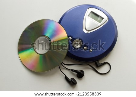 Vintage CD Player with headphones isolated on white background. Vintage Technology from the 90s. Royalty-Free Stock Photo #2123558309