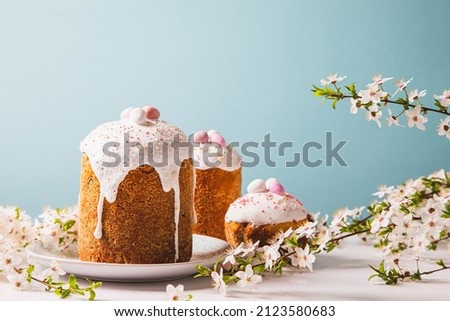 Easter cake with glace icing and decoration. Postcard with Easter bread. Christian traditions. Copy space. White background Royalty-Free Stock Photo #2123580683