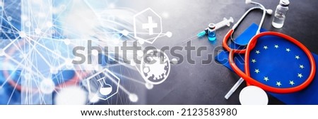 Health care concept. EU flag and stethoscope on gray background. Vaccination and epidemic.