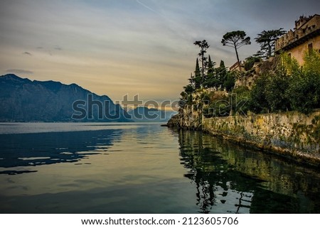 Winter at Lake Garda, seen from Malcesine in Verona Province, Veneto, north east Italy. Crenellations from Malcesine castle can be seen in the background