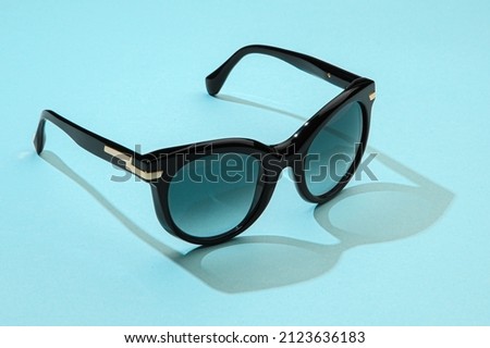 Sunglasses in minimal summer concept for fashion female vacation.
