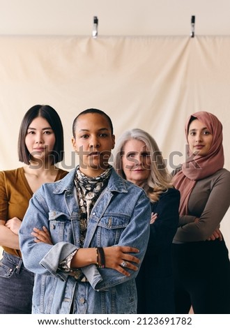 Mid adult LGBTQ woman in support of International Women's Day with multi ethnic female friends Royalty-Free Stock Photo #2123691782