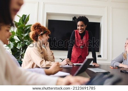 Mature black woman in business meeting with multi ethnic colleagues Royalty-Free Stock Photo #2123691785