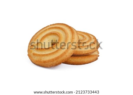 Round ring shaped German spritz biscuits on white background Royalty-Free Stock Photo #2123733443