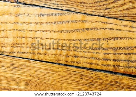 Aged parquet floor. Natural oak tree texture. Wooden background with organic pattern vintage planks. Macro photography, up view