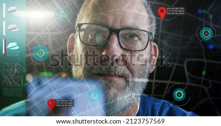 Autonomous Electric cars driving on computer screen with technology assistant tracking information, showing details. fleet management concept  Royalty-Free Stock Photo #2123757569