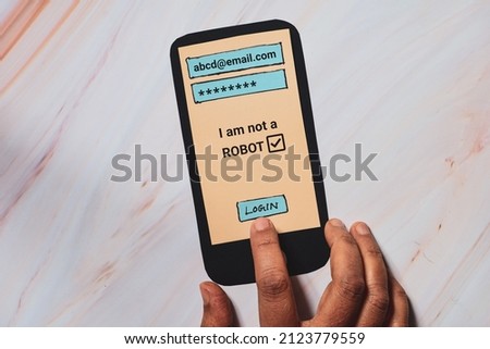 Woman hand touching login page on paper smartphone. Conceptual, top view.