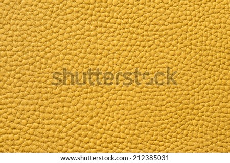 Closeup of seamless yellow leather texture for background