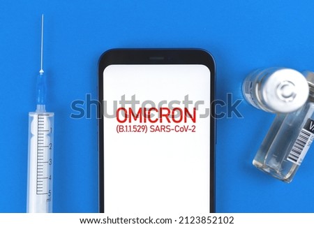Coronavirus Omicron B.1.1.529 mutations. Medical table background with syringe and vaccine vials, concept of vaccination