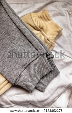 sweatshirt fragment vertical top view. serigraphy production. printing images on clothes in a design studio Royalty-Free Stock Photo #2123852378