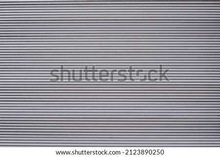 Texture striped background: protective street ventilation metal iron grates, gray steel grating. Grey blinds, venting