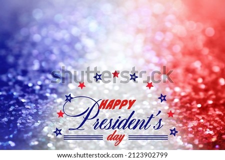 Happy President's Day - federal holiday. Blurred view of glitters in colors of American national flag, bokeh effect
