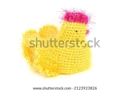 Handmade Easter toy - yellow chicken for keeping Easter eggs and table decoration.